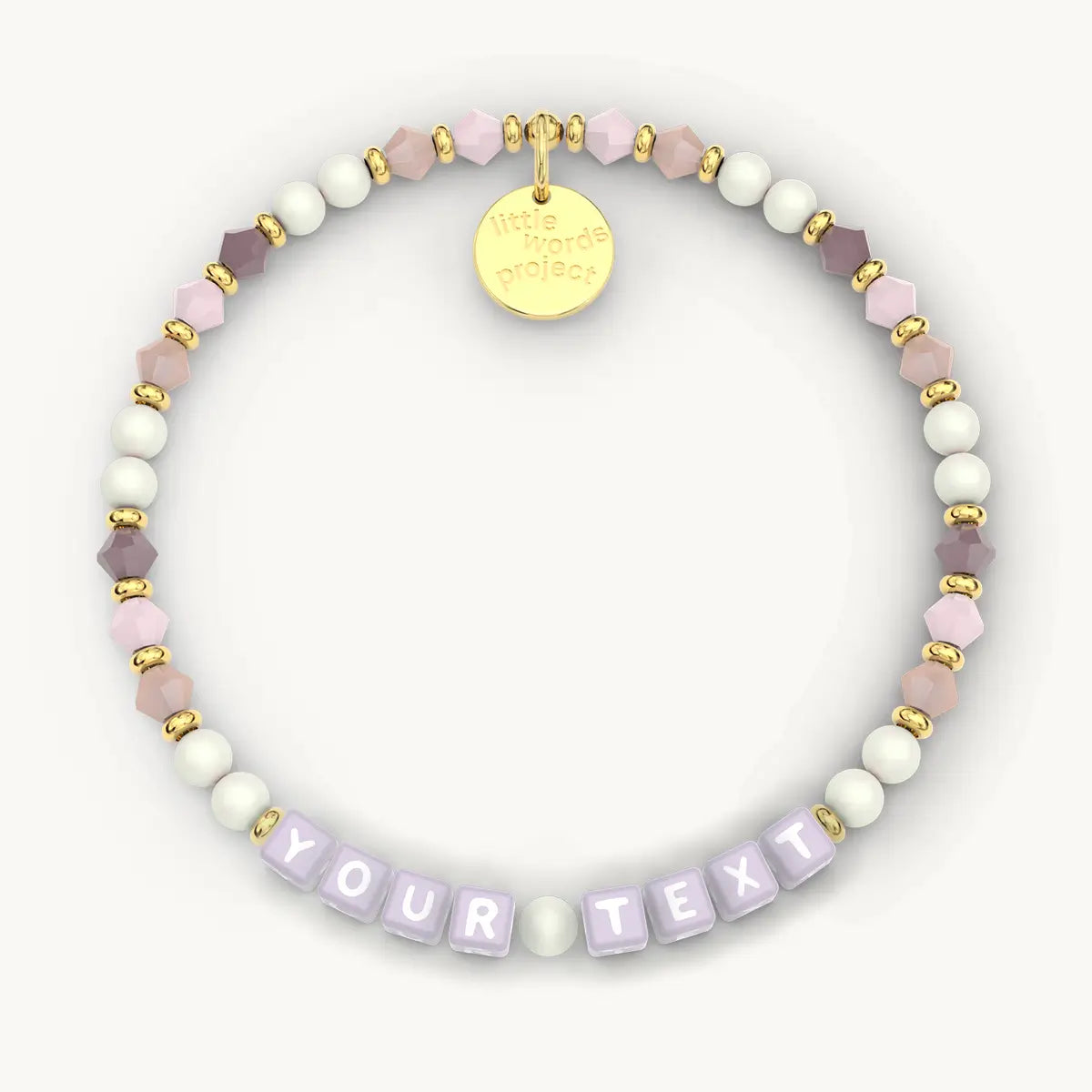 Beaded bracelet with 'Your Text' section and gold tag on a white background