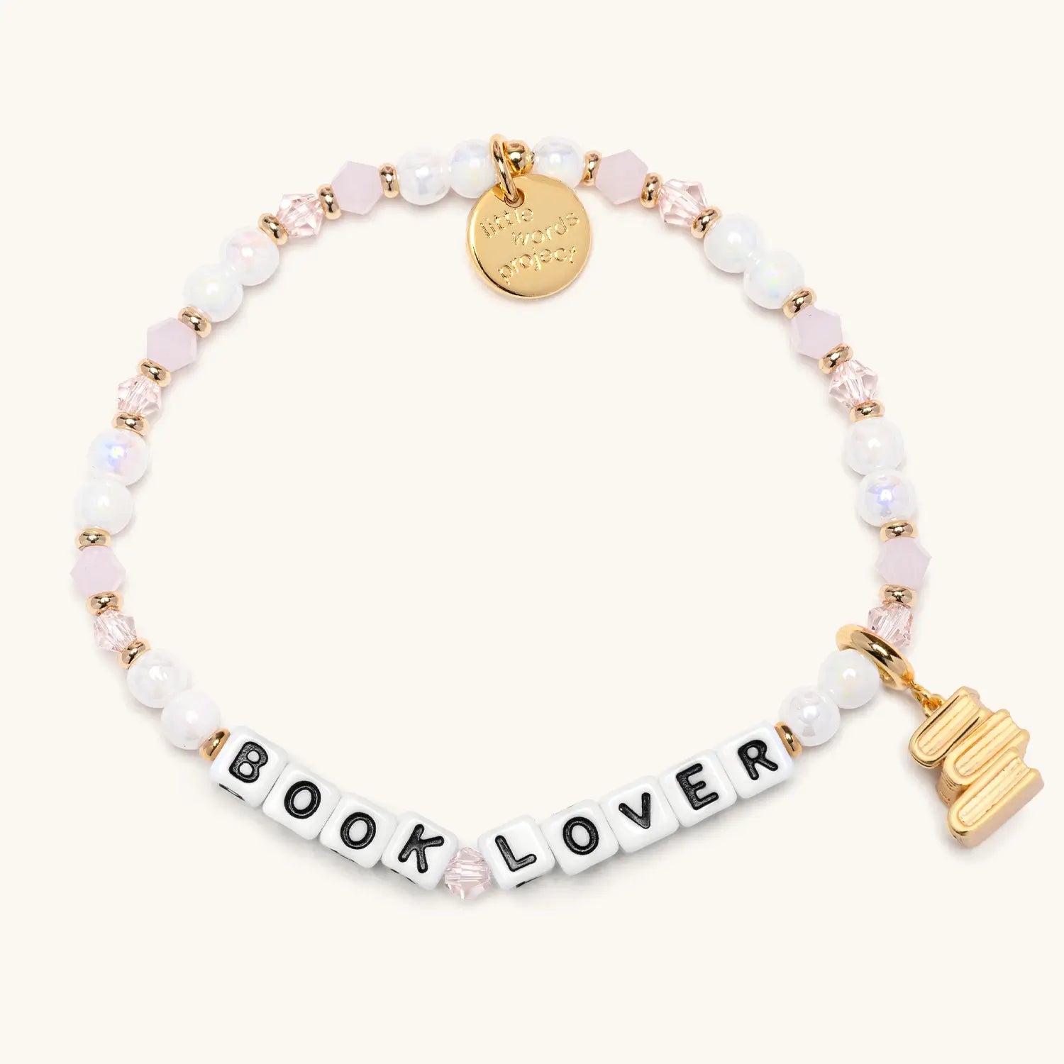 Bracelet with 'BOOK LOVER' and gold book stack charm on a white background