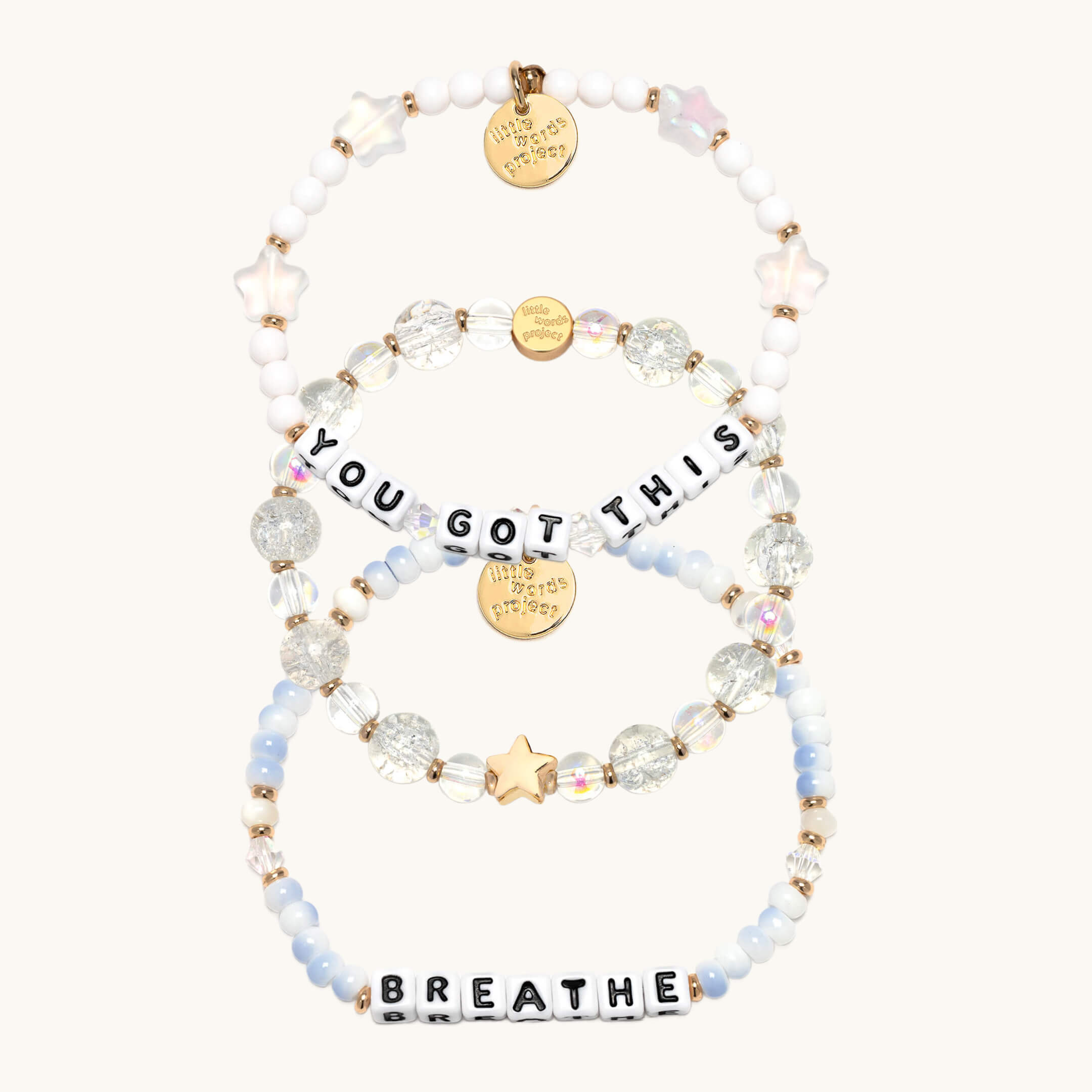 Set of beaded bracelets with motivational phrases on a white background