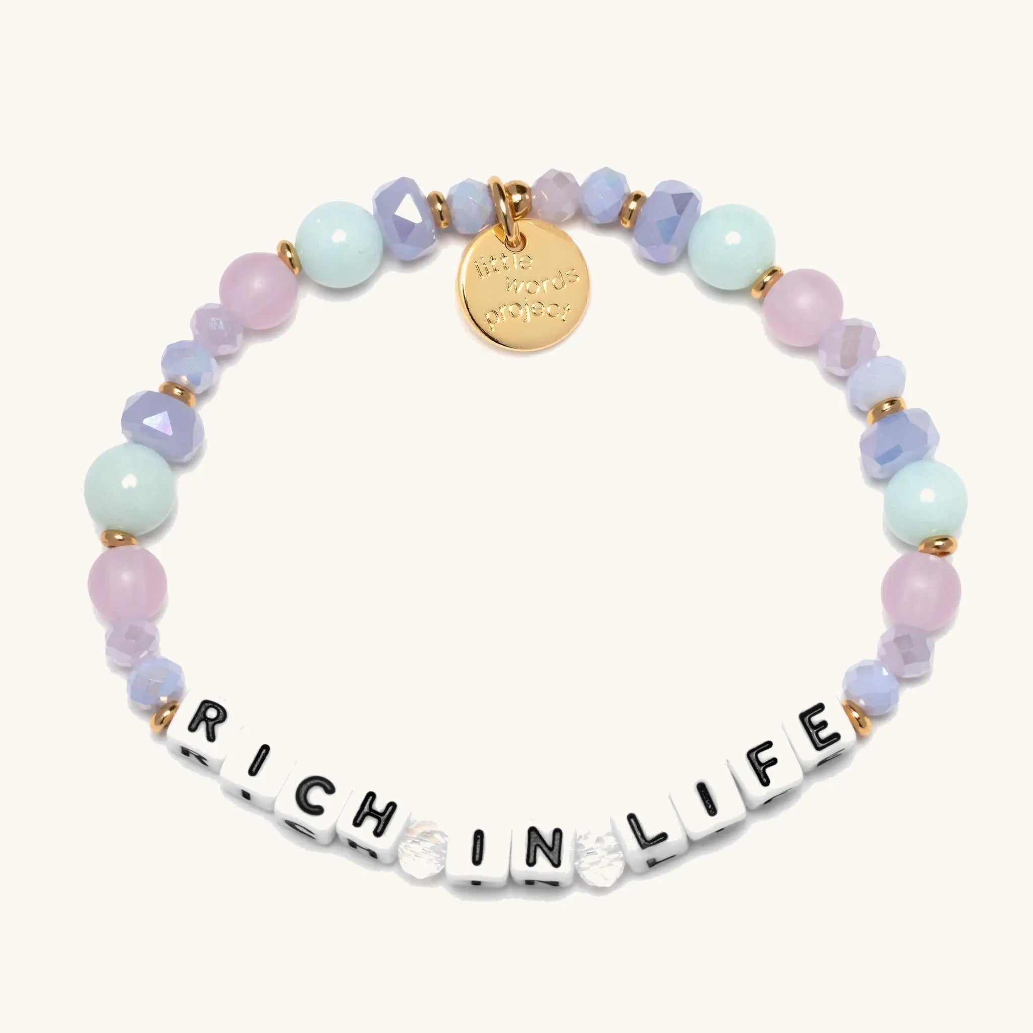 Multicolored beaded bracelet with 'Rich in Life' on a white background