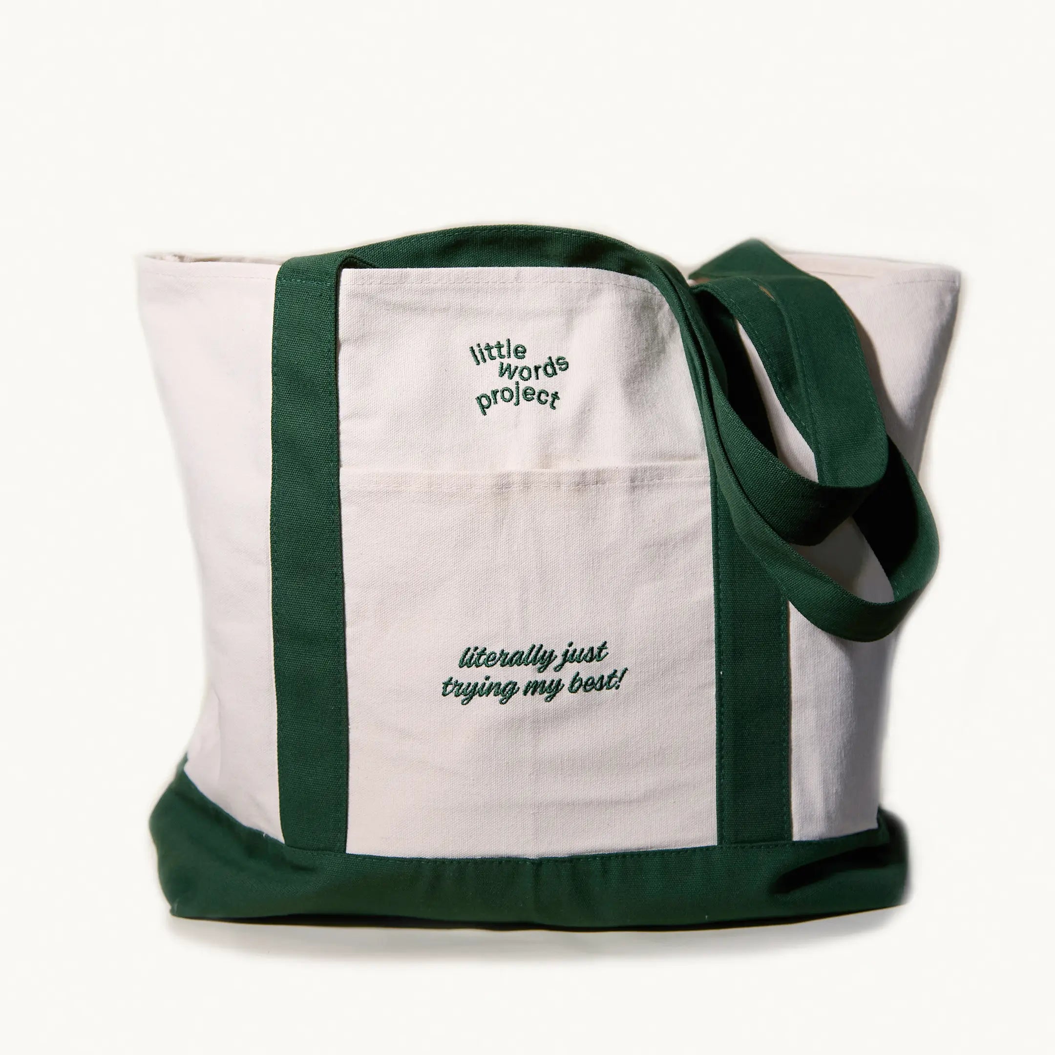 Tote bag with 'little words project' text on a white background