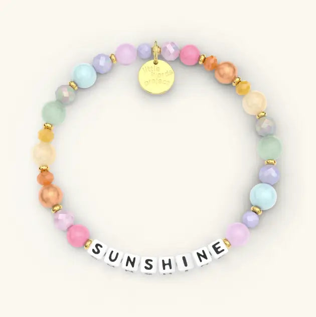 Colorful beaded bracelet with 'SUNSHINE' on a white background