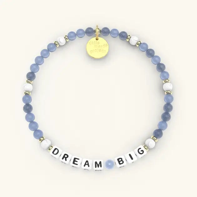 Bracelet with blue beads and 'Dream Big' on a white background