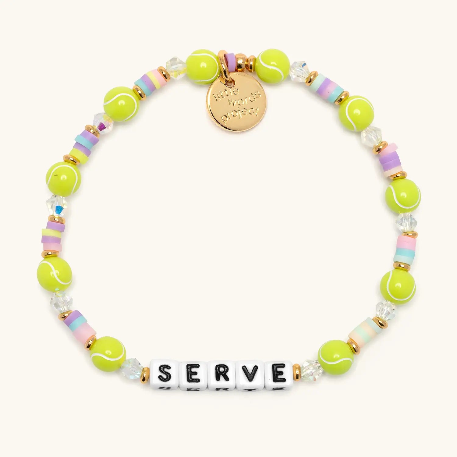 Serve tennis bracelet flat lay with neon tennis ball beads, pastel heishi discs, clear crystals, gold accents, and white letter beads spelling SERVE