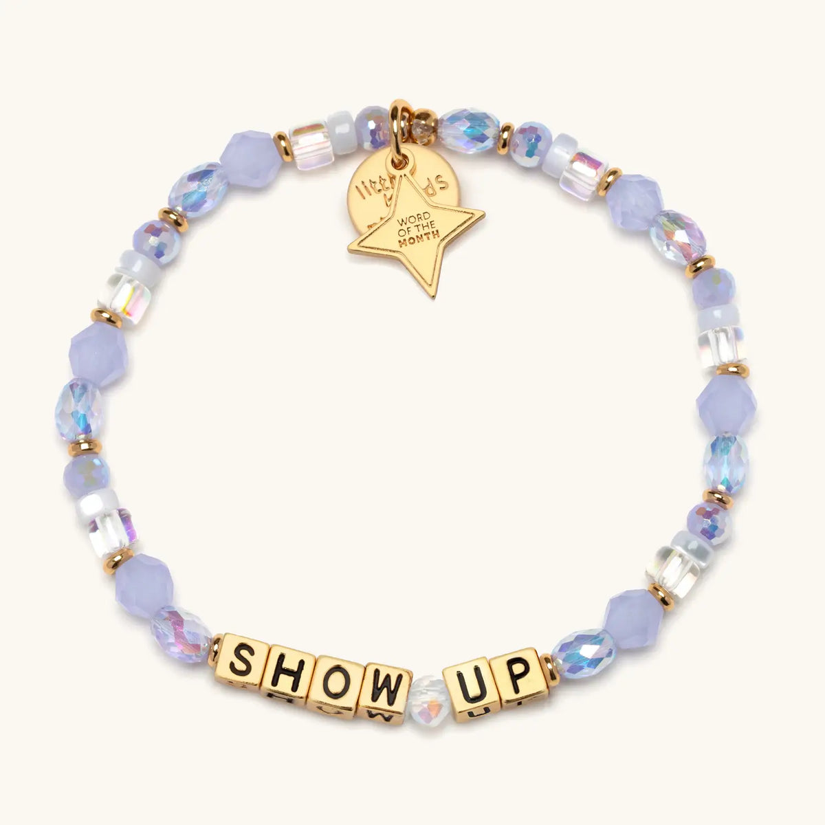 Show Up bracelet with gold letter beads and a gold tag, from the Six Months of Intention set