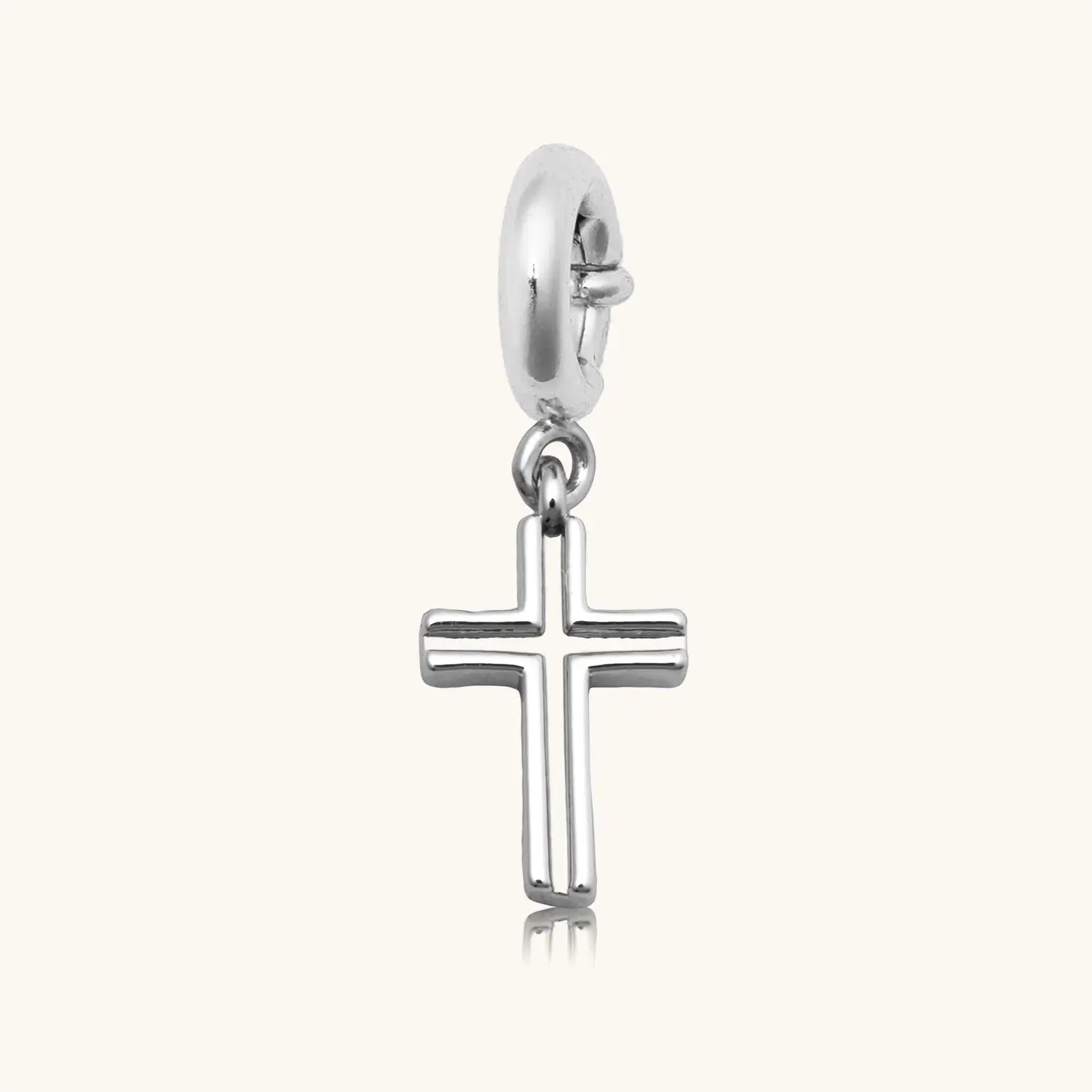 Silver open-cut cross charm pendant with a spring-ring clasp, shown on a white background.