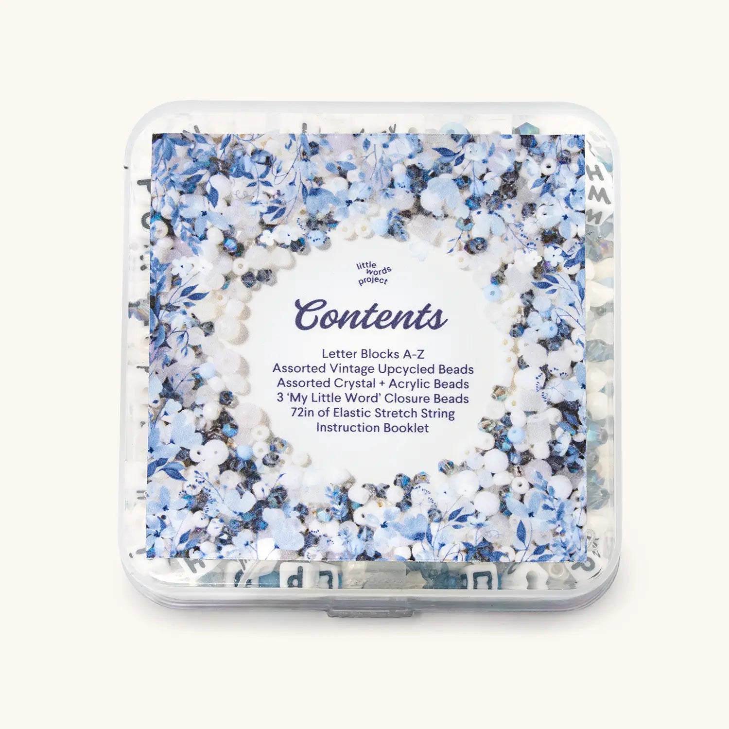 Back of the Something Blue bead kit box showing the Contents label, over blue and white beads