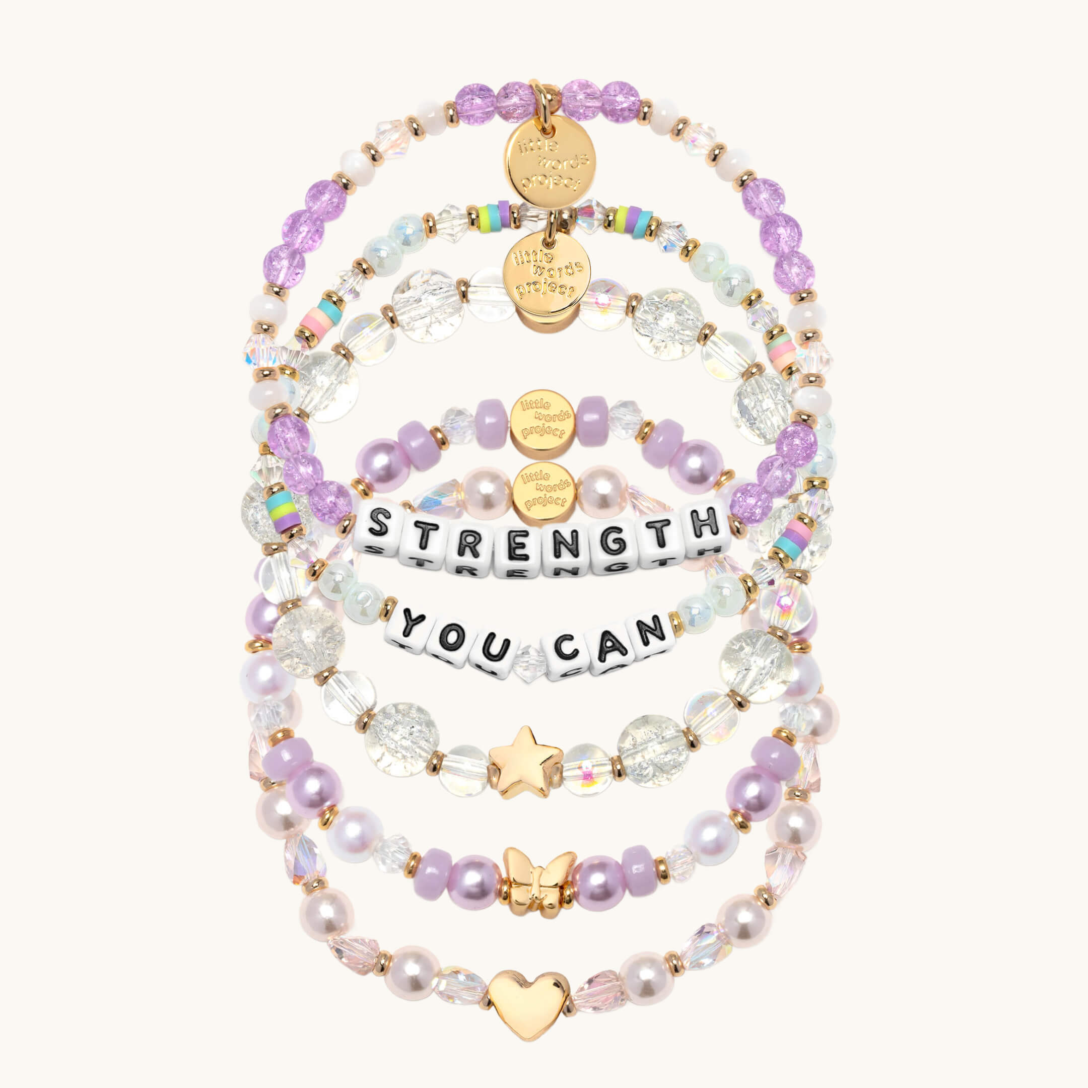 Set of beaded bracelets with motivational phrases on a white background