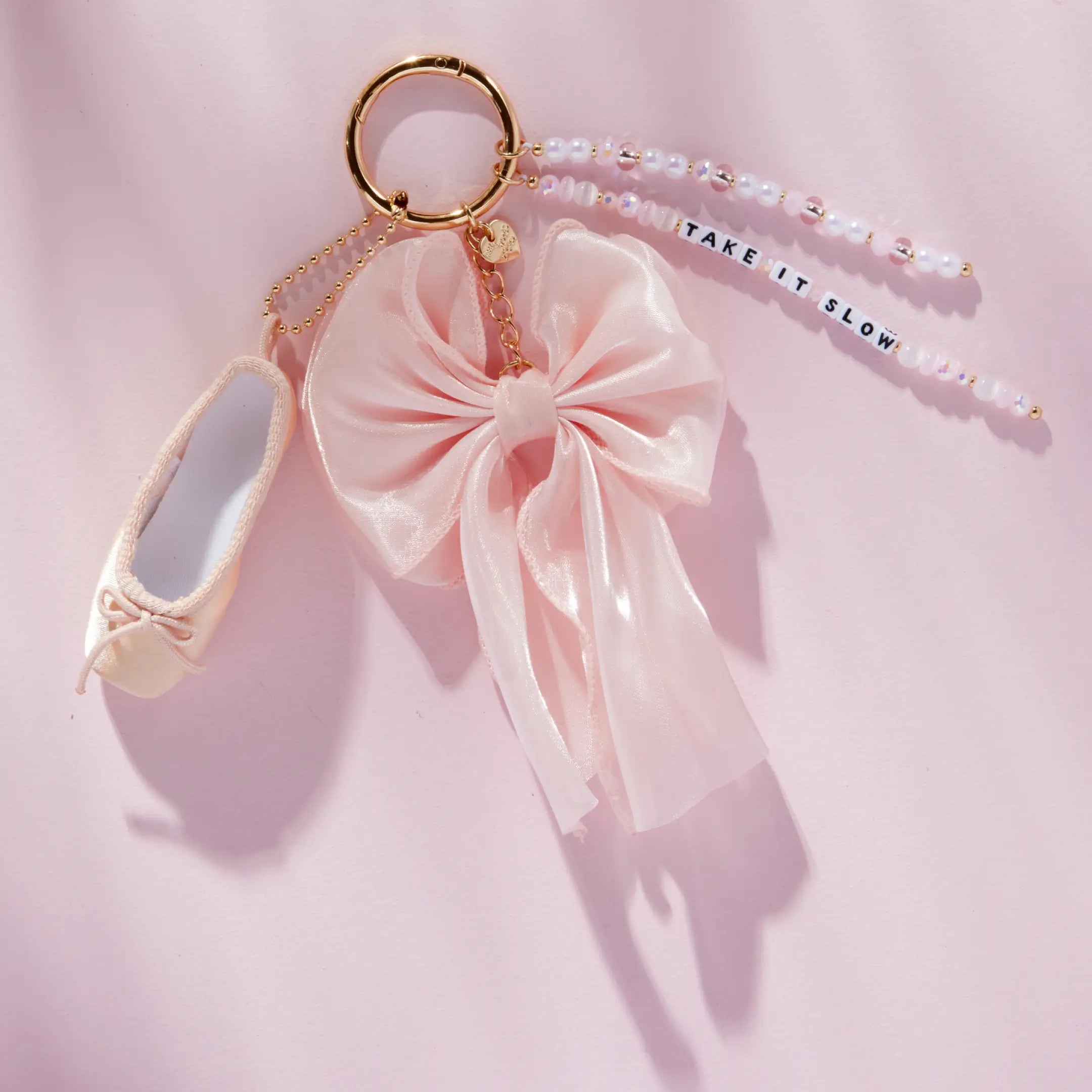 Take It Slow satin bow bag charm, detail shot
