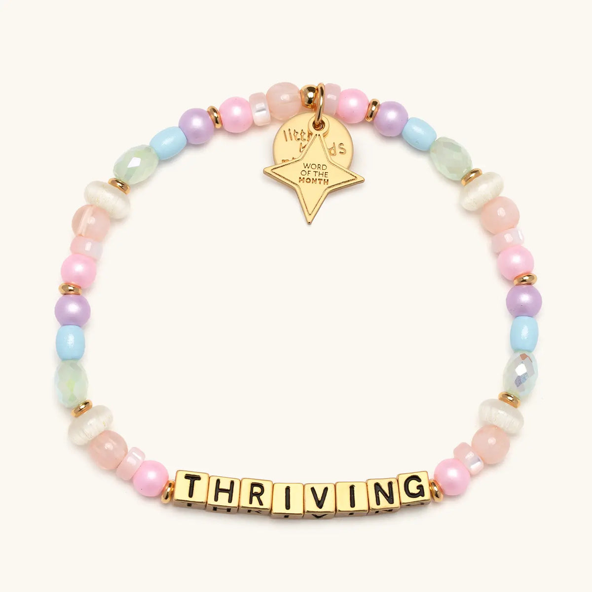 Thriving bracelet with multicolored beads and gold letter beads, from the Six Months of Intention set