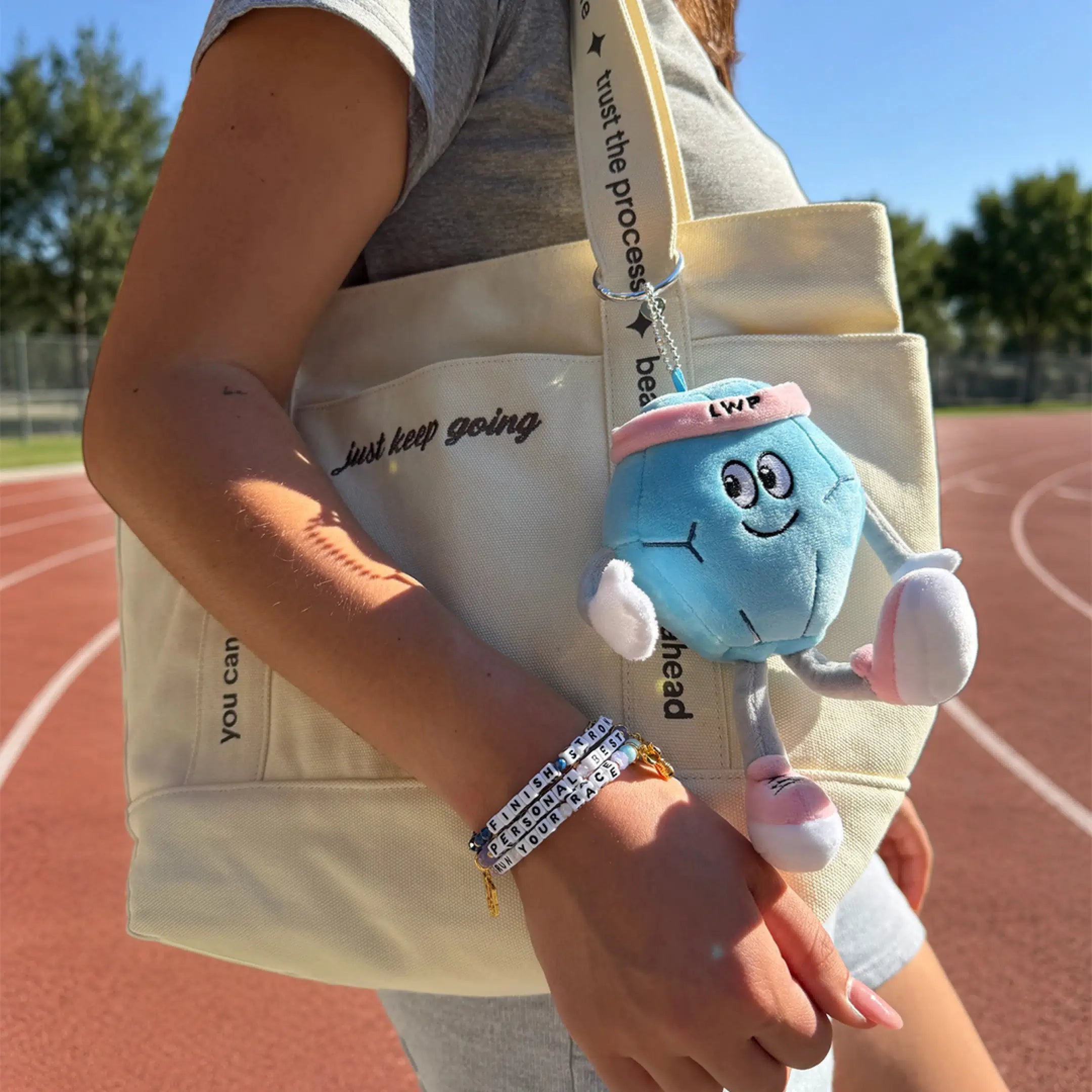Little Words Project Global Run Day collection, tote and accessories flat-lay