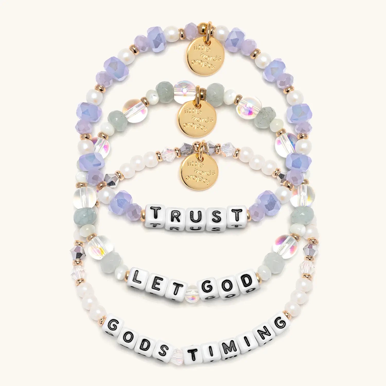 Set of beaded bracelets with inspirational text on a white background