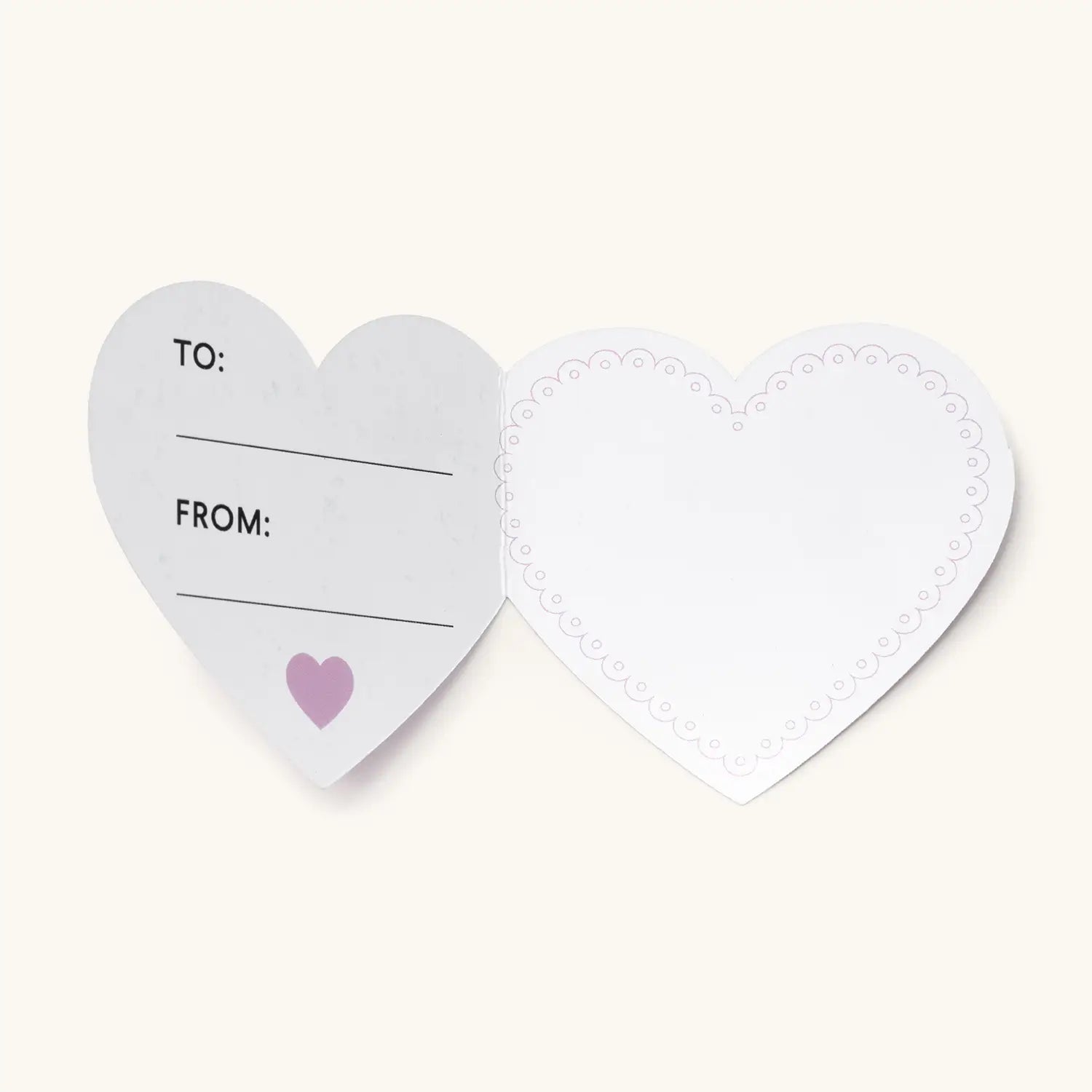 Heart-shaped gift tag with 'To' and 'From' fields on a white background