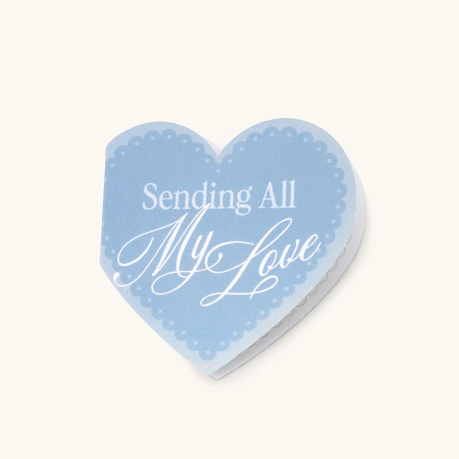 Heart-shaped blue card with 'Sending All My Love' text on a white background