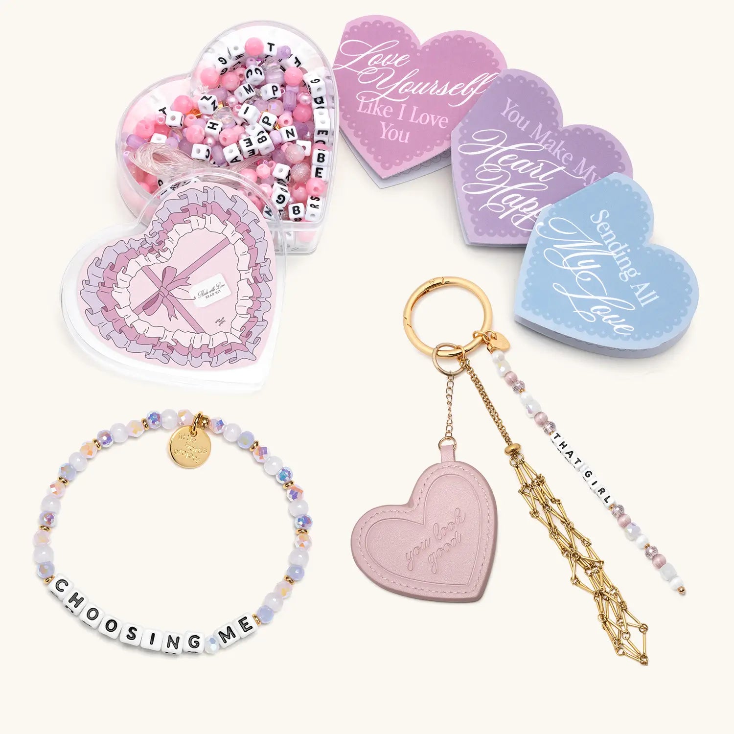 Heart-shaped accessories including a keychain, bracelet, and decorative items on a white background