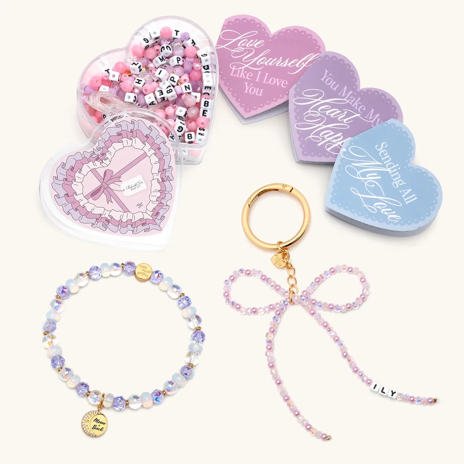 Set of heart-shaped cards with a bracelet and keychain on a white background