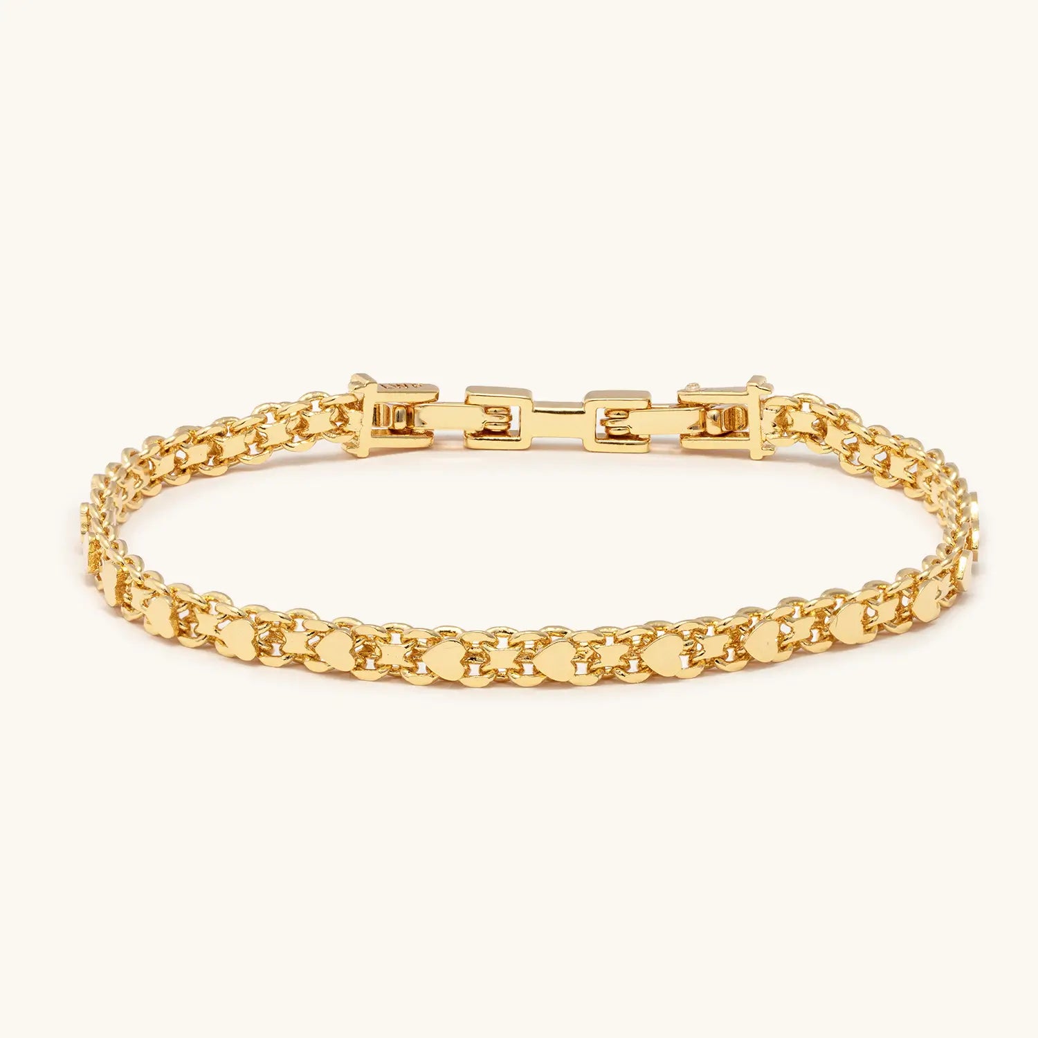 Gold bracelet on a white background