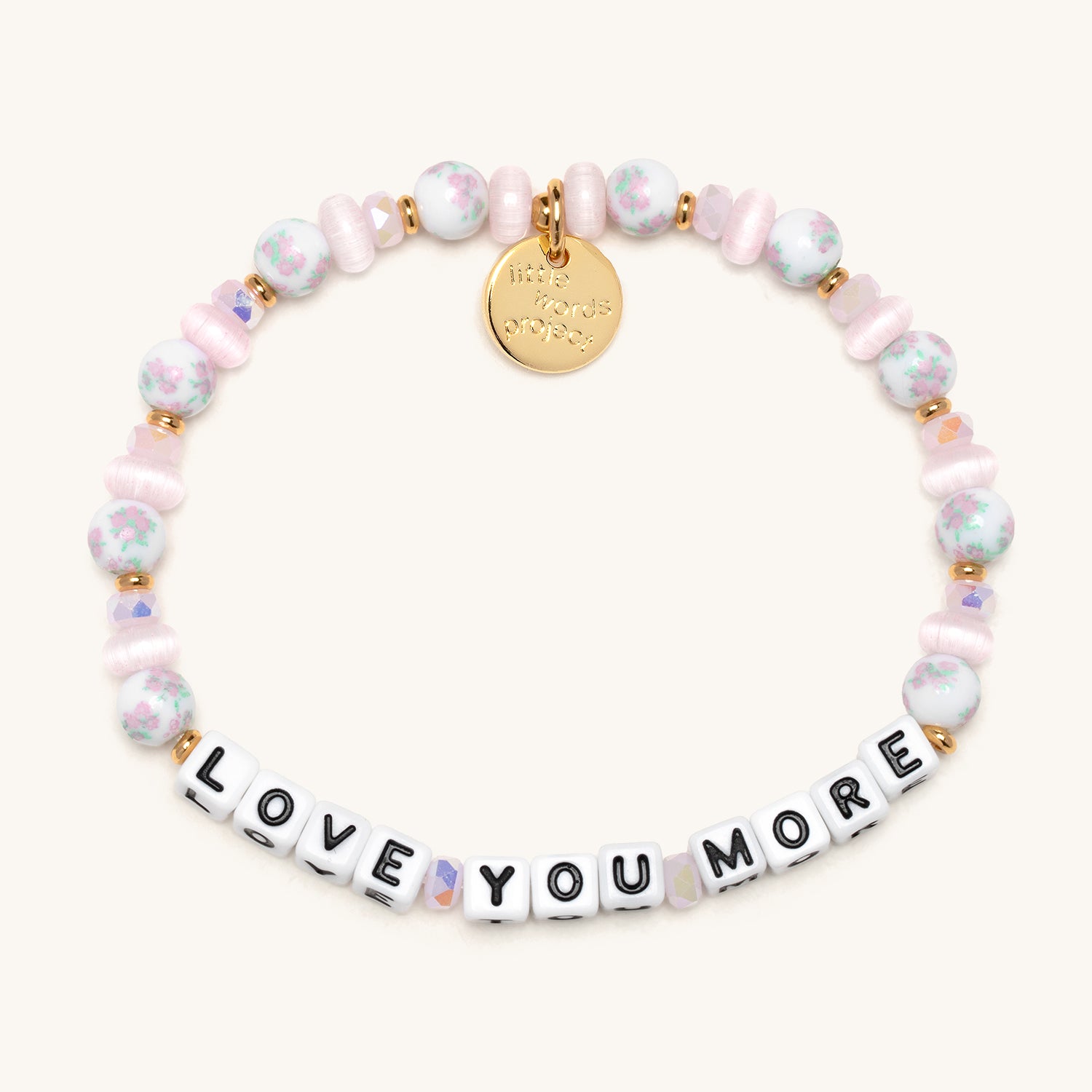 Bracelet with 'LOVE YOU MORE' beads on a white background