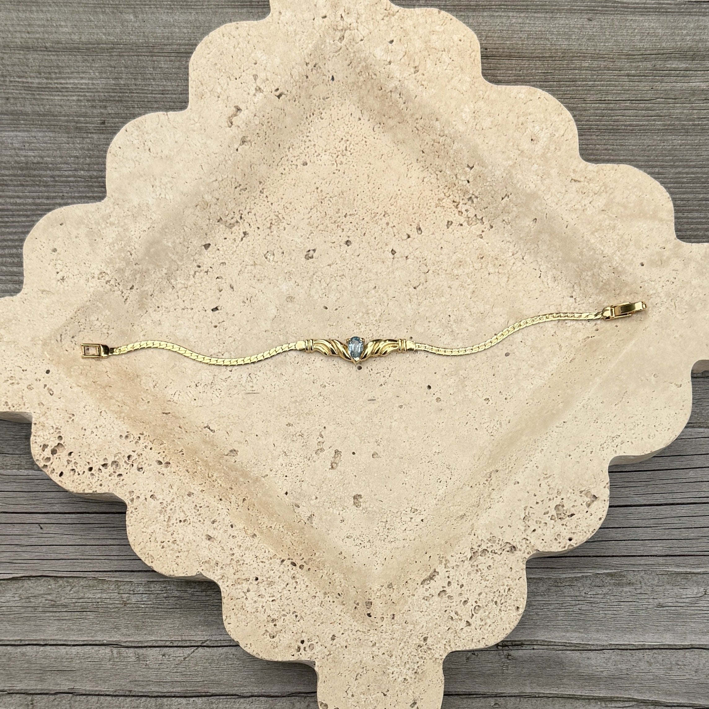 Gold Bracelet with Blue Stone Center