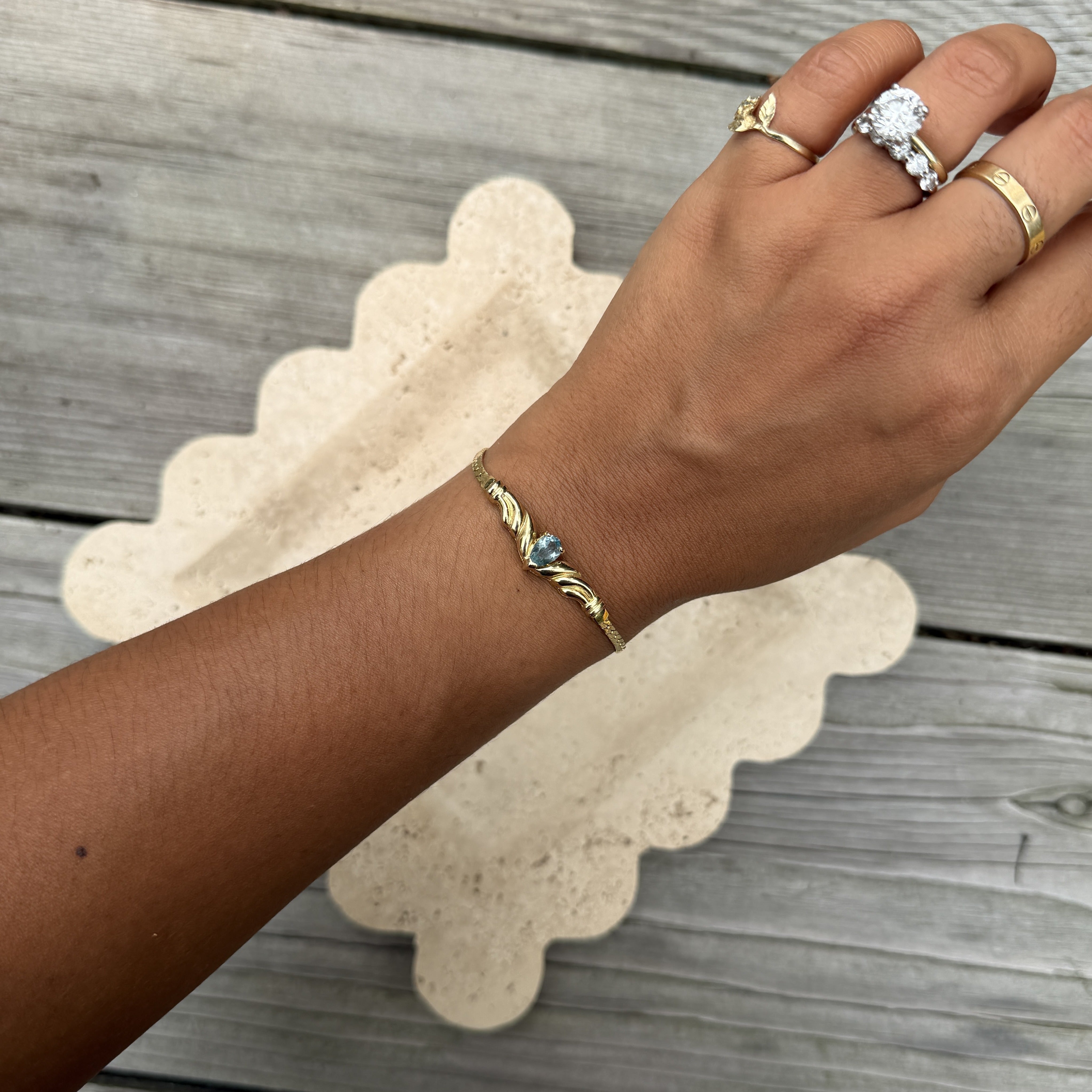 Gold Bracelet with Blue Stone Center