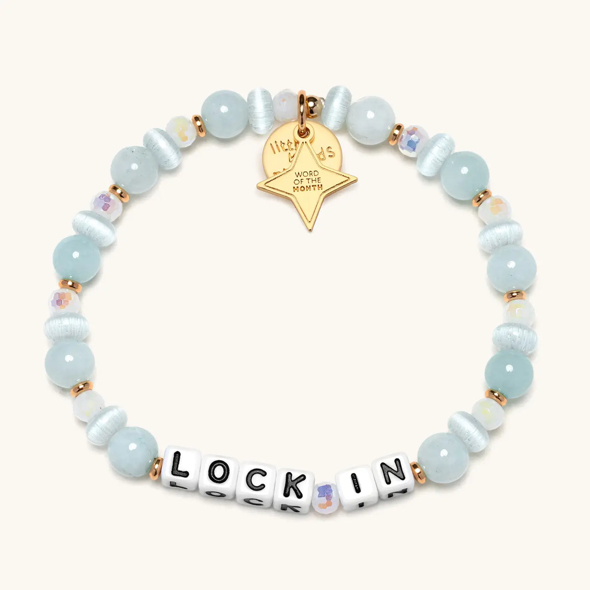 Lock In bracelet with light blue beads and white letter beads, from the Six Months of Intention set