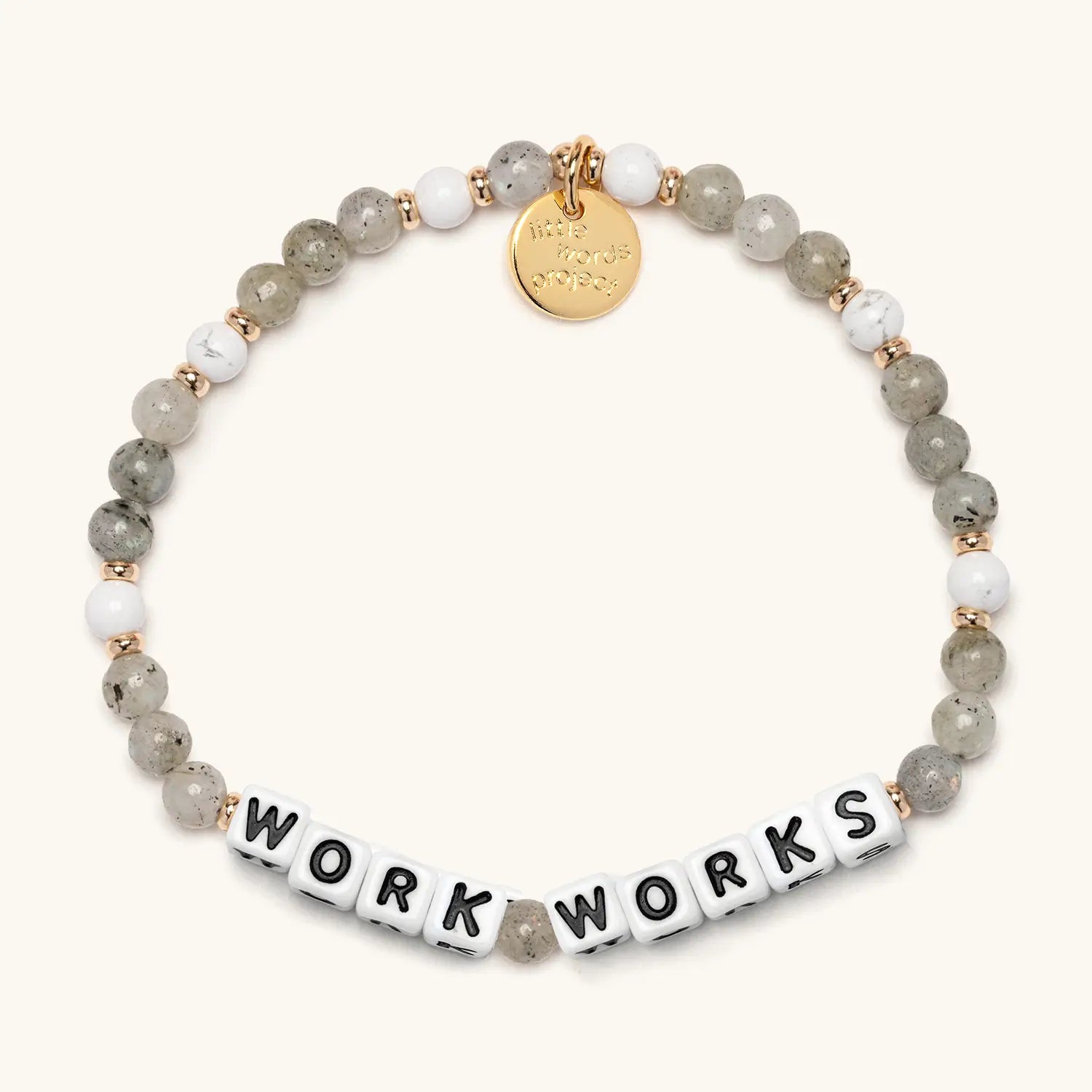 Bracelet with beads and letter tiles on a white background