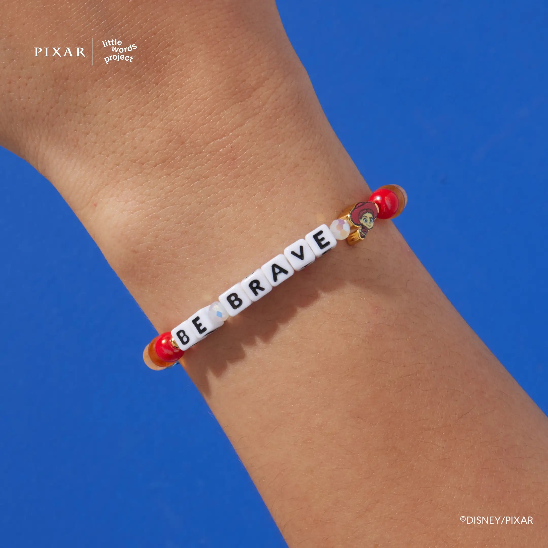 Be Brave Toy Story bracelet worn on a model's wrist against a blue background