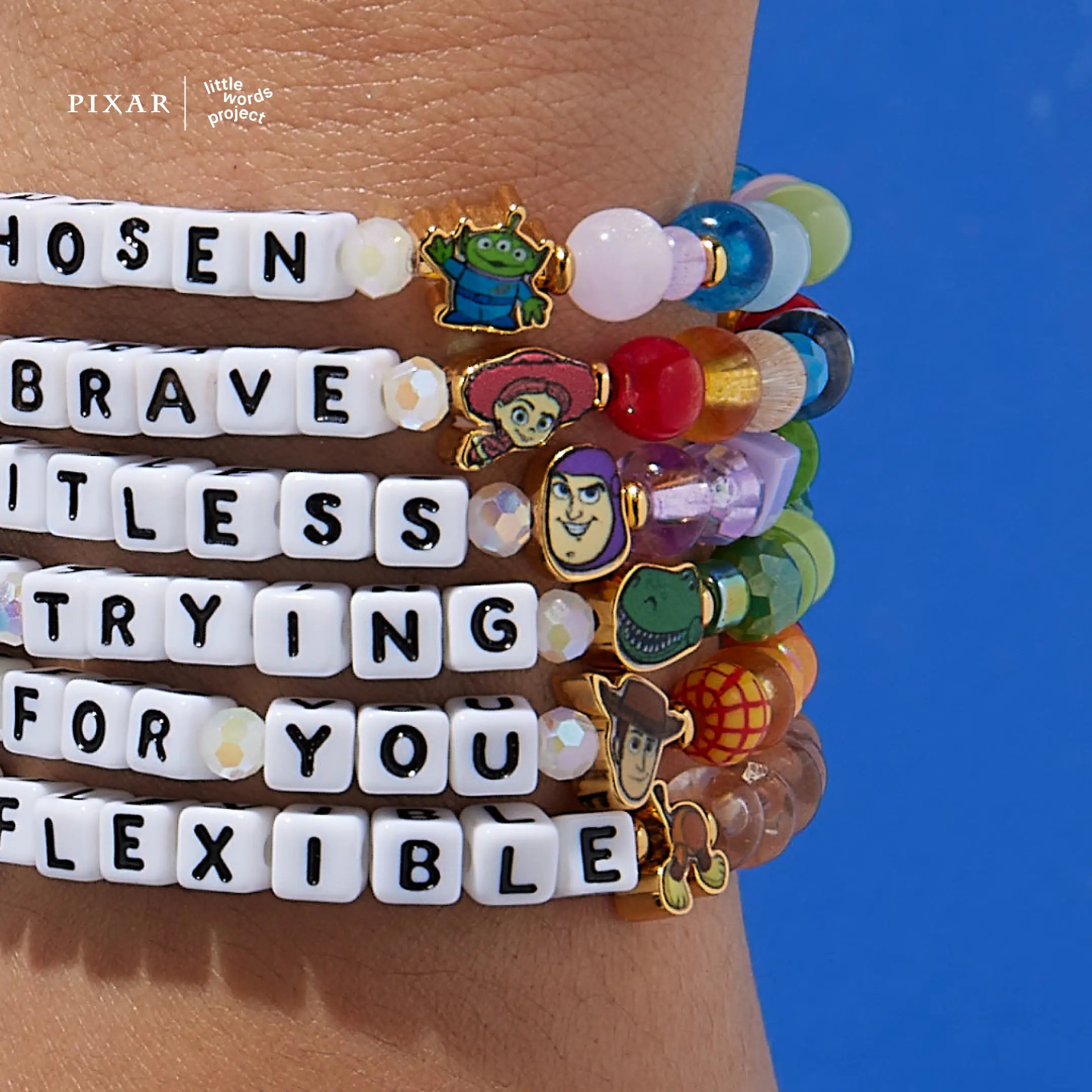 Deluxe Toy Story bracelet set stacked on a model's wrist showing all six character bracelets