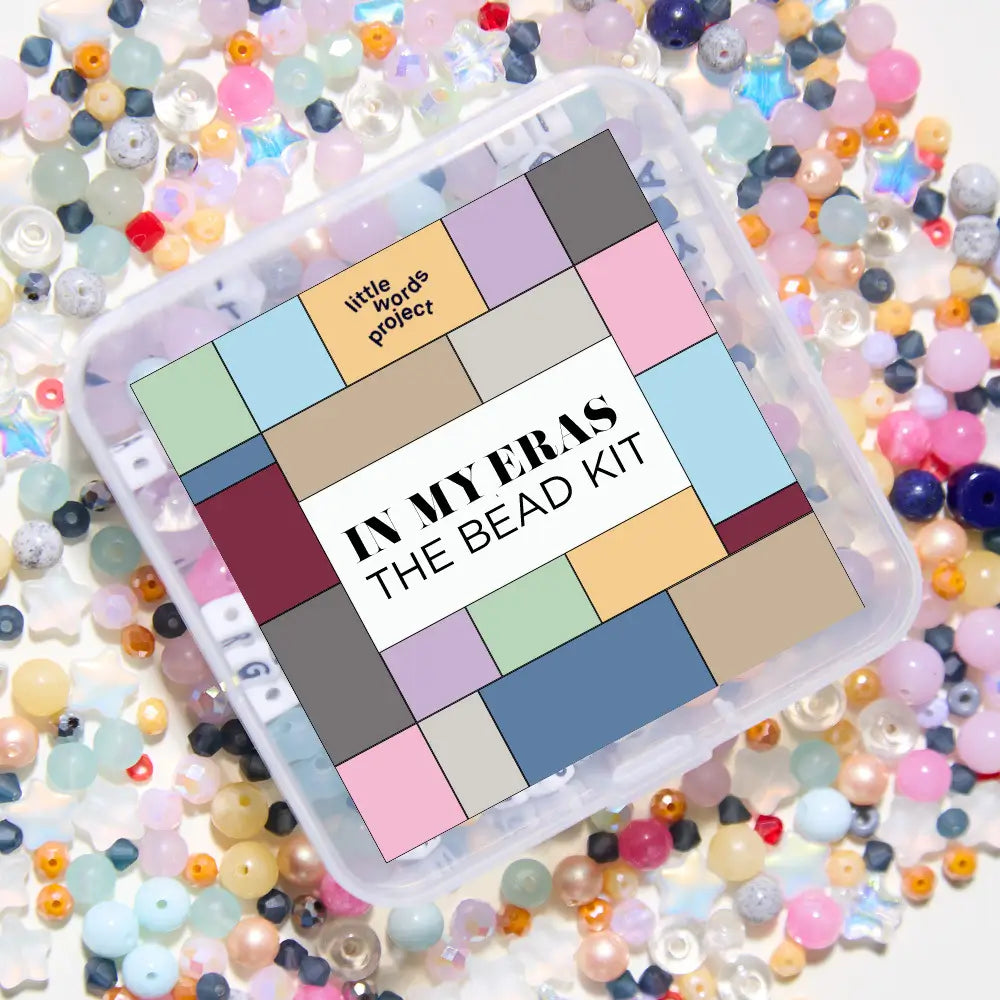 Bead kit with colorful beads around it, featuring 'little words project' branding.