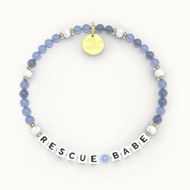 Giveback Rescue Babe bracelet with blue stone and white beads, gold hardware, flat-lay product shot