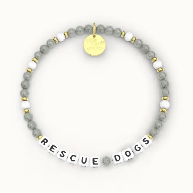 Giveback Rescue Dogs bracelet with grey stone and white beads, gold hardware, flat-lay product shot