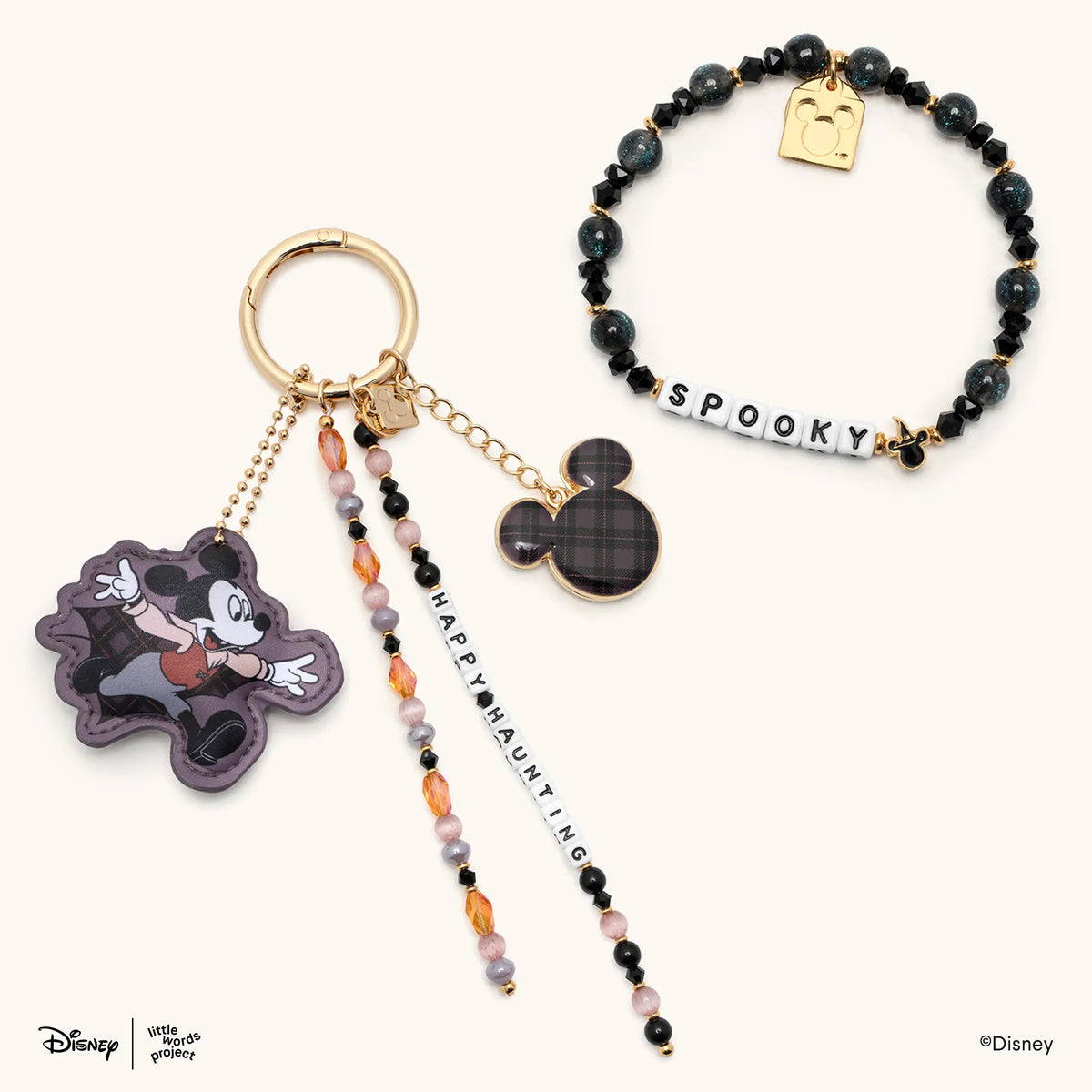 Spooky Vibes Set from Disney's Mickey & Friends showing the black beaded Spooky bracelet alongside the Happy Haunting beaded bag charm, flat-lay